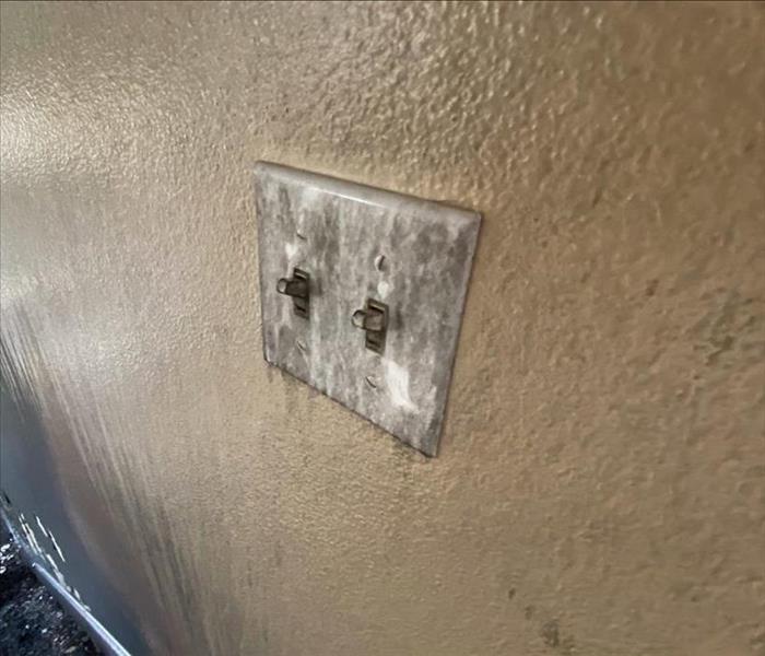 Fire Damaged Drywall and Light Switch
